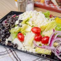 Greek Salad · Crisp romaine lettuce topped with tomato, beets, Greek olives, red onions, pepperoncinis, fe...