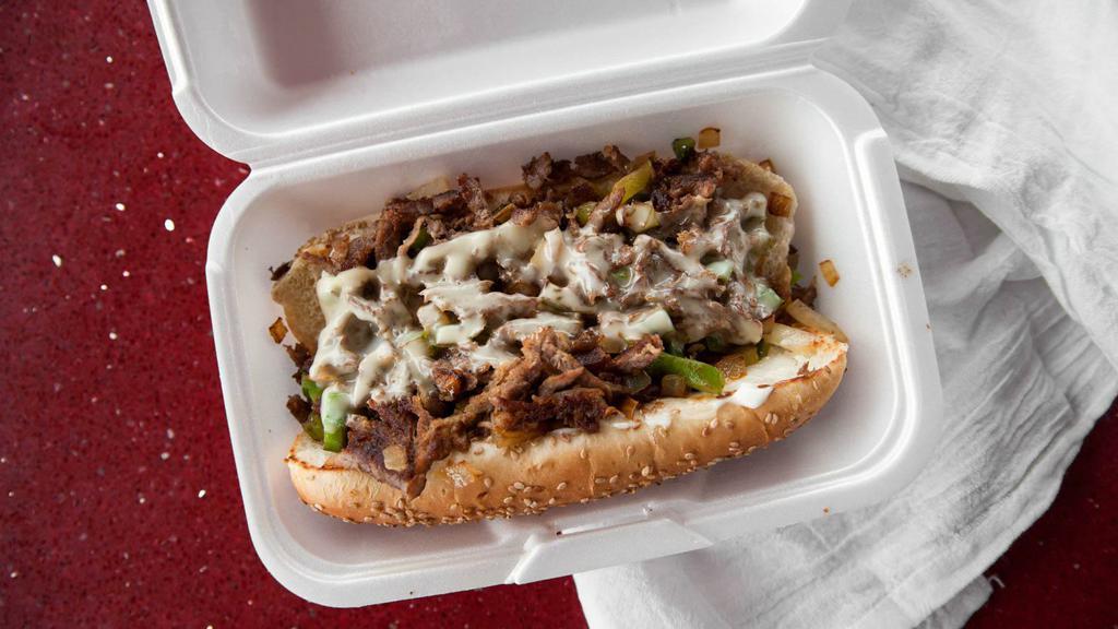 Philly Steak Sandwich With Fries · Grilled onions, mushrooms, peppers and Swiss cheese.