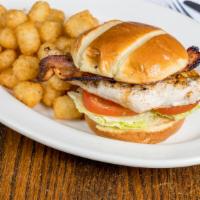 Chicken B.L.T. · Bacon, fresh lettuce, tomatoes and char broiled chicken on a toasted bun with an order of ou...