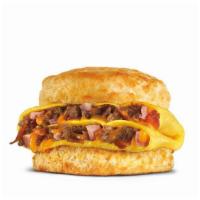 Loaded Omelet Biscuit · Loaded omelet filled with crumbled sausage, bacon, ham and American cheese stacked on a Made...