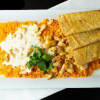Arroz Con Pollo · Traditional rice with chicken topped with melted queso & side of corn tortillas.