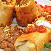 Chimichanga · Crunchy chimichanga, chicken, steak or beef, queso on top served with rice and beans, lettuc...