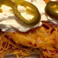 Chimichanga Twins · Two small crunchy chimichangas, chicken, steak or beef, queso on top served with rice and be...