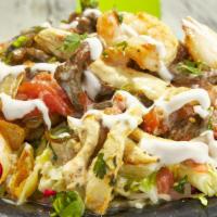 Bomb Nachos Mazatlan · Steak, chicken, shrimp, grilled onions and tomatoes covered with our delicious queso. Lettuc...