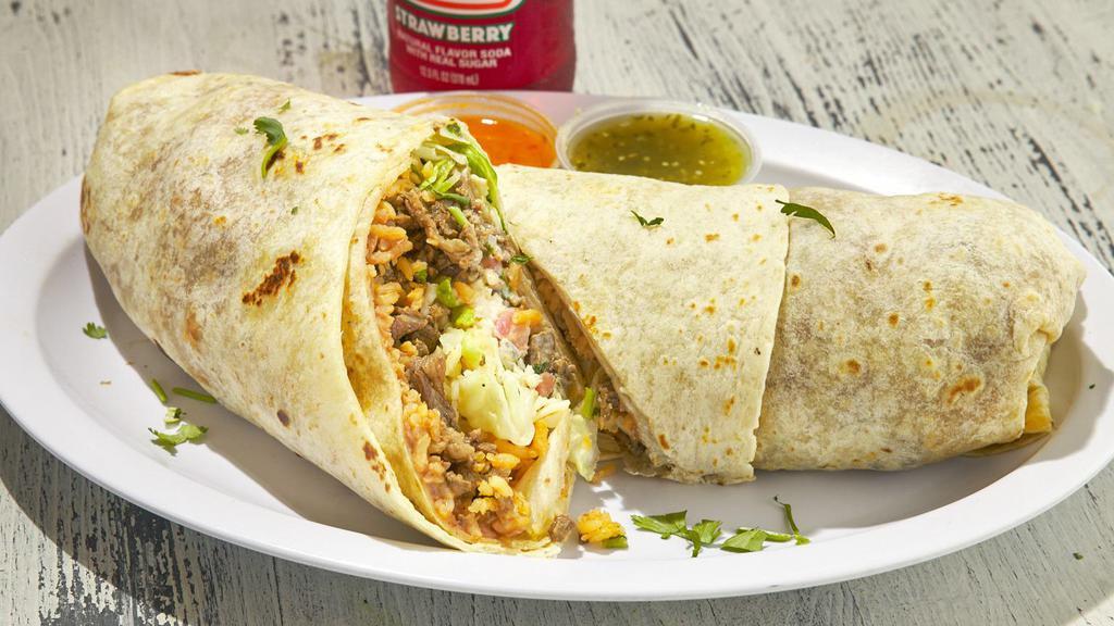 Mexican Burrito · Our traditional burrito served with salsa verde, salsa Roja, and queso on top.