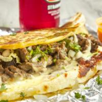 Al Pastor Quesadilla · Flour tortilla with shredded cheese, marinated pork with grilled onions and pineapple inside...