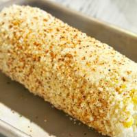 Elote (Street Corn) · Traditional mexican corn on the cob, with mayo, queso cotija, and chili powder.