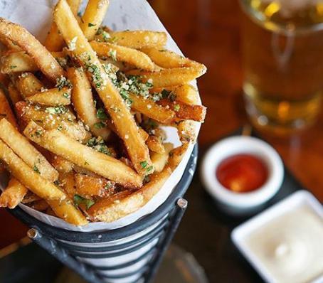 Vegan Truffle Parmesan Fries^ · Crispy fries, tossed in white truffle oil, vegan Parmesan cheese and house seasoning with rosemary garlic aioli.

Dish with a component that has been fried in a mixed-use fryer.