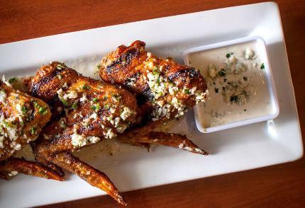 Crave Wings · Jumbo wings marinated overnight, grilled and fried until crispy, then tossed in your choice of lemon garlic or classic buffalo sauce, served with cucumber sticks and your choice of bleu cheese or ranch dipping sauce.