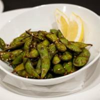 Edamame · Tossed in our signature house-made sriracha soy glaze.