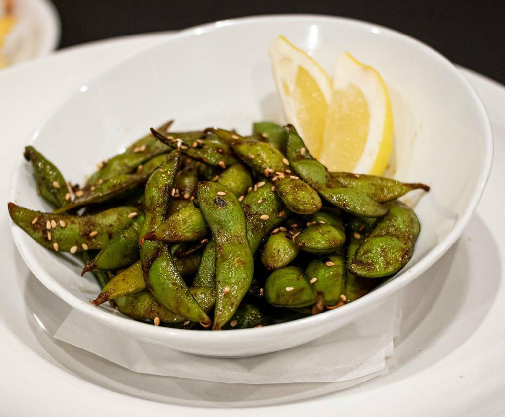Edamame · Tossed in our signature house-made sriracha soy glaze.