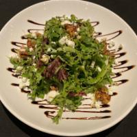 Crave Salad · Revol Greens spring mix tossed in tangy balsamic vinaigrette, topped with candied walnuts, g...