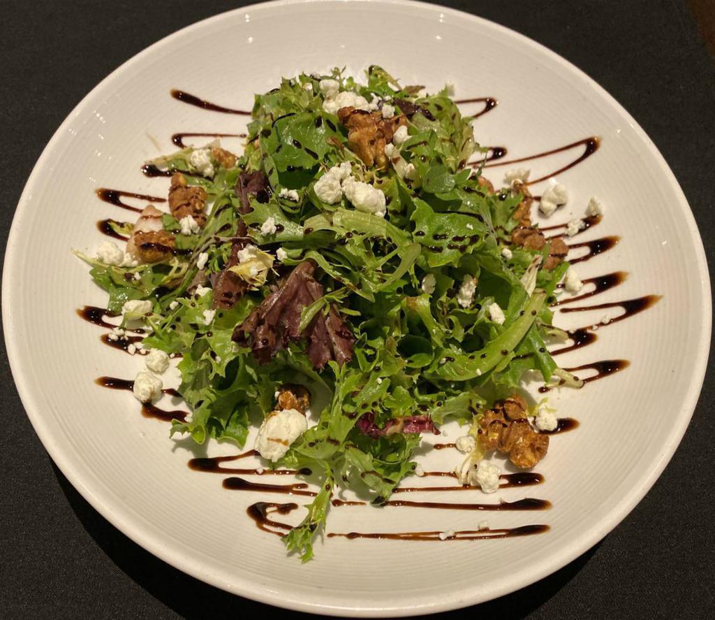 Crave Salad · locally grown spring mix tossed in tangy
balsamic vinaigrette, topped with candied
walnuts, goat cheese & balsamic glaze