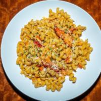 Lobster Mac & Cheese · lobster meat sautéed with fresh garlic & white wine then tossed with cavatappi noodles in a ...