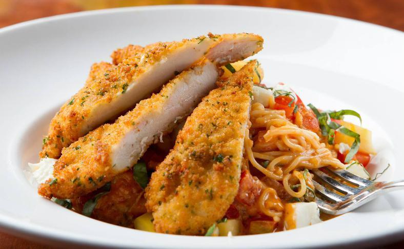 Chicken Caprese Rosa · Crispy all natural Parmesan chicken breast topped with melted fresh mozzarella, on a bed of linguini, tossed in a house-made rosa sauce with fresh red and yellow tomatoes, garlic and herbs, finished with fresh mozzarella and julienne basil.