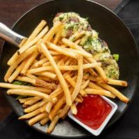 Steak Frites^ · Hand cut certified Angus beef medallions
topped with béarnaise sauce, served with
house seas...