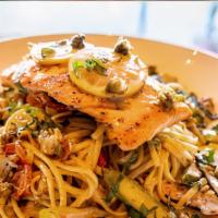Salmon Piccata · seared Verlasso salmon filet 
served over a bed of linguini 
noodles tossed in lemon oil, 
g...