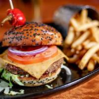 Crave Veggie Burger · Impossible burger, topped with smoked cheddar, iceberg lettuce, beefsteak tomato, and crave ...