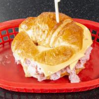 Ham & Cheese Croissant · Hot Polish ham piled high on a buttered and toasted croissant and topped with American chees...