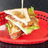 Blt · Bacon, lettuce and tomato with mayonnaise on toasted white bread. Add fries for an additiona...