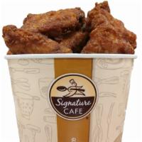 Combo Wing Bucket (2.5 Lbs) · Combination wing bucket with honey and hot & spicy wings.