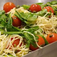Lemon Capellini Salad · Capellini pasta is tossed with tomatoes, capers, garlic and parsley in a lemon vinaigrette d...