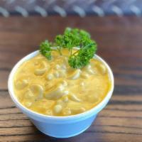 Mac & Cheese · Elbow macaroni in a creamy cheddar cheese sauce.