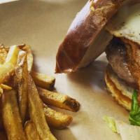 House Burger · 8 oz black angus, applewood smoked bacon,choice of cheese and an egg served on a pretzel bun.