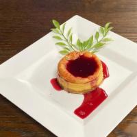 Cheesecake · Homemade cheesecake with raspberry sauce