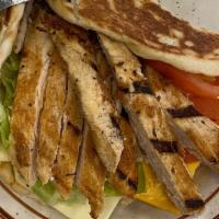 Grilled Chicken Pita · Warm pita served with grilled chicken, lettuce, tomato, American and Swiss cheese.