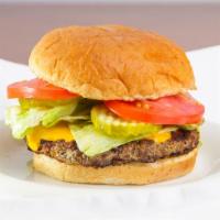 Turkey Burger · Turkey patty served on a grilled bun with lettuce tomato and pickle.