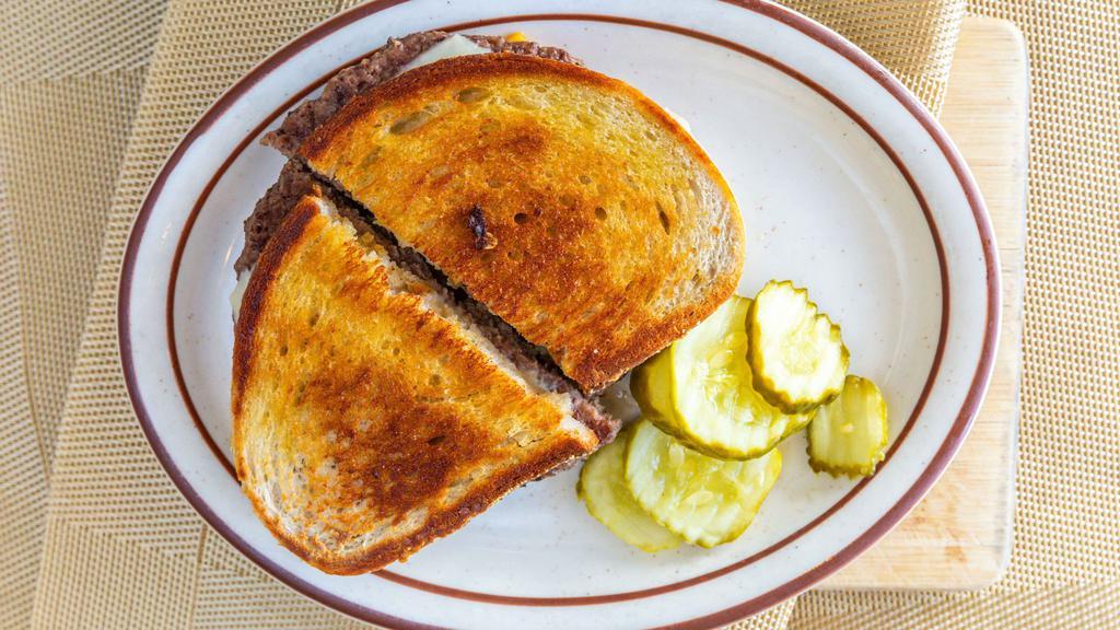 Patty Melt · Hamburger served with grilled onions, American and Swiss cheese on grilled the bread.