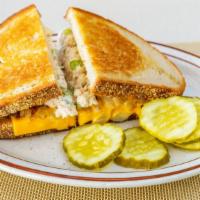Tuna Melt · Homemade tuna salad with grilled onions, American and Swiss cheese on grilled rye bread.