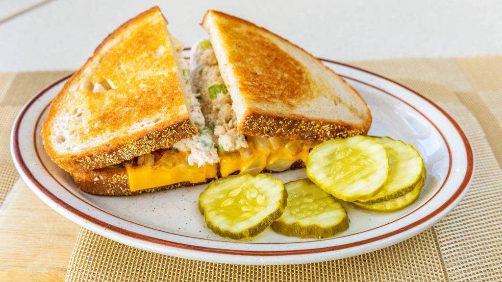 Tuna Melt · Tuna on grilled rye with melted American and swiss cheese and grilled onions.