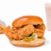 Fried Chicken Sandwich · Fried chicken breast on a bun with lettuce, tomato, and pickle.