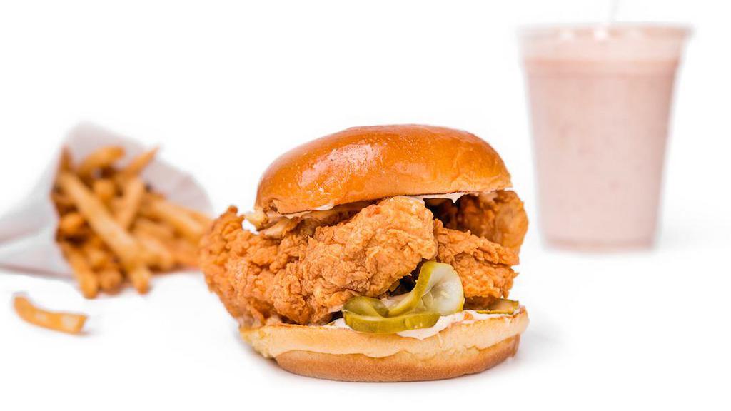 Crispy Chicken Sandwich · Fried chicken with lettuce and tomato on a bun.