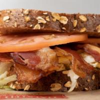 Lasalle St (Blt) · Bacon piled high with shredded lettuce, tomato and mayo served on honey wheat eight grain br...