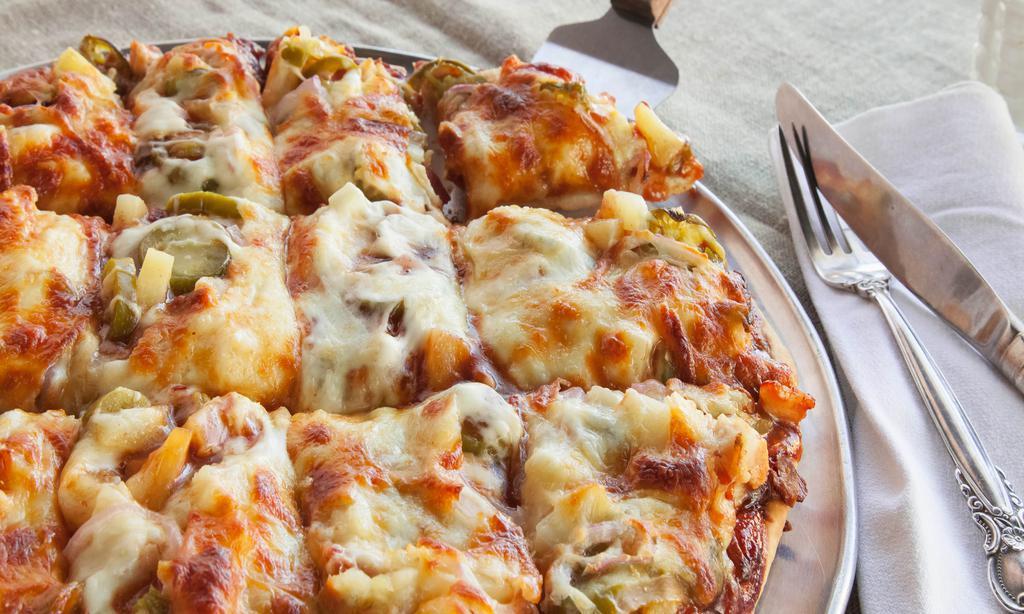Bbq Chicken Pizza · Grilled chicken, BBQ sauce and red onions smothered with cheddar and mozzarella cheese.