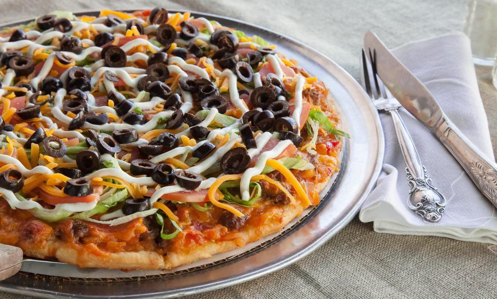 Family Taco Pizza · Chunky salsa, ground beef or chicken and Cheddar cheese baked, then layered with sour cream, shredded lettuce, diced tomatoes and sliced black olives.