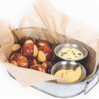 Pretzel Nuggz · flash-fried & salted. served with warm cheese sauce & horsey mustard for dipping.