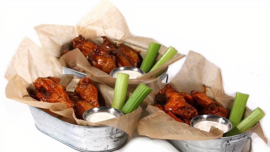 The Wings · basket of jumbo chicken wings served with celery & ranch or bleu cheese. tossed in your choice of sauce..