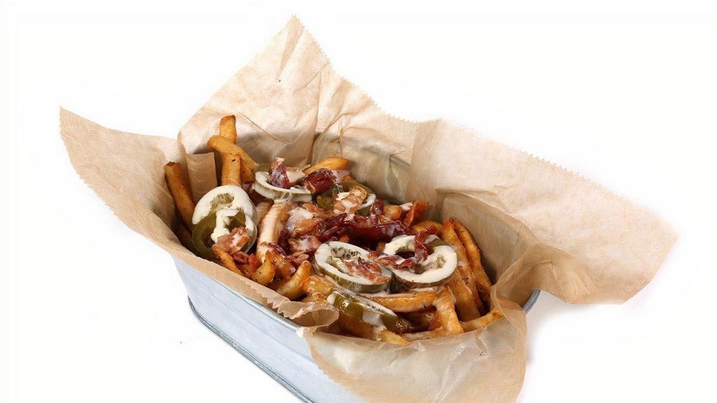 Loaded Cosmik Fries · hickory-smoked bacon, red onion & pickled jalapeño. smothered in warm cheese sauce.