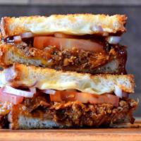 Brisket Grilled Cheese  · Smoky beef brisket, Provolone and cheddar cheese and grilled onions on artisan bread with ga...