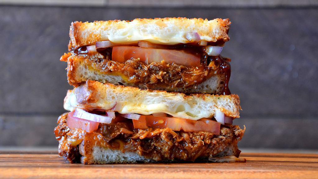 Brisket Grilled Cheese  · Smoky beef brisket, Provolone and cheddar cheese and grilled onions on artisan bread with garlic butter.