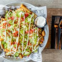 Mexican Fries · Fries topped with nacho cheese, jalapeños, sour cream, lettuce and tomato (option of chicken...