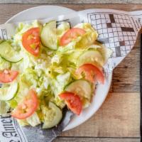 House Salad · Iceberg lettuce, red onion, cucumbers, and tomatoes served with your choice of dressing.