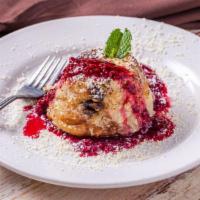Bread Pudding · Warm baked bread pudding with real vanilla and house-made raspberry sauce. Vegetarian. Conta...