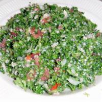 Tabouleh Salad · Fresh chopped parsely pre-mixed with tomatoes, onions, bulgur wheat, all tossed with lime ju...