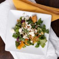 Beet Salad · Roasted red and yellow beets, fresh oranges, carrots, toasted almonds, and feta cheese on a ...