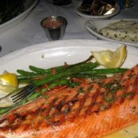 Norwegian Salmon (À La Carte) · Grilled fillet of buttery, cold water salmon finished with herb-garlic butter.

Consuming ra...